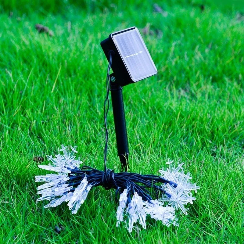 Saulės energija įkraunama girlianda "Naktinės snaigės"